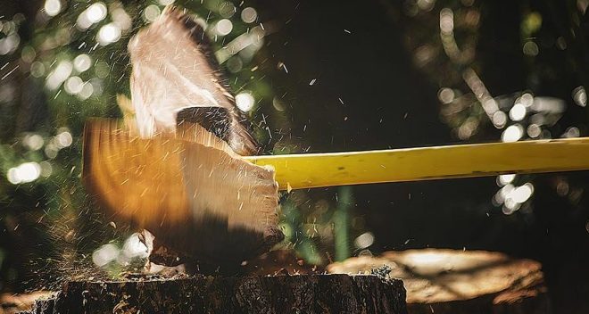 An axe chopping wood