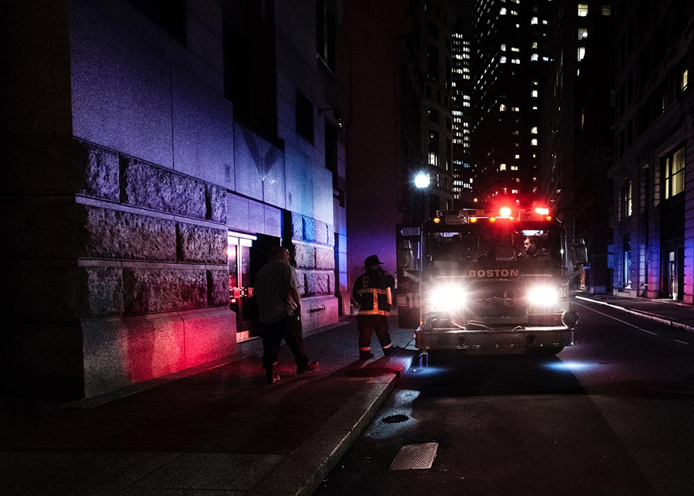 Dark alleyway with police and fire service